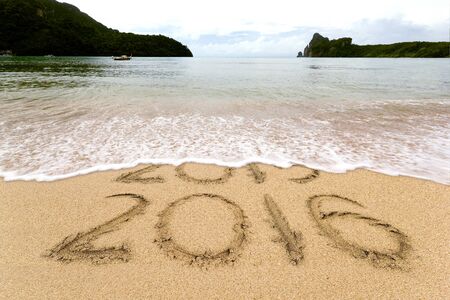 New Years 2016 is coming concept, 2016 replace 2015 concept on the sand beach