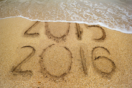 New Years 2016 is coming concept, 2016 replace 2015 concept on the sand beach