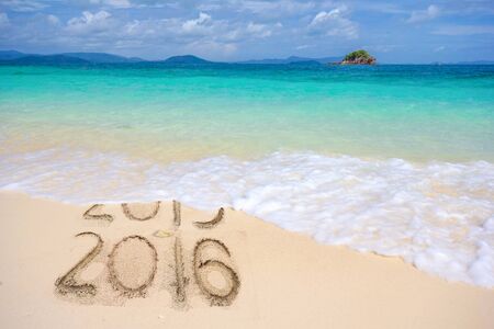 New Years 2016 is coming concept, 2016 replace 2015 concept on the sand beachの写真素材