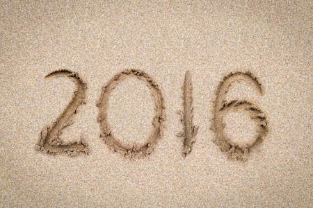 New Years 2016 concept, 2016 on the sand backgroung Textureの写真素材