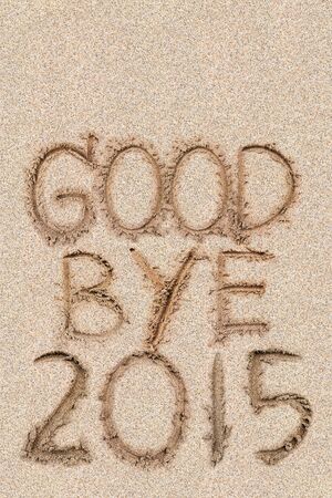 New Years 2016 concept, Goodbye 2015 on the sand backgroung Textureの写真素材