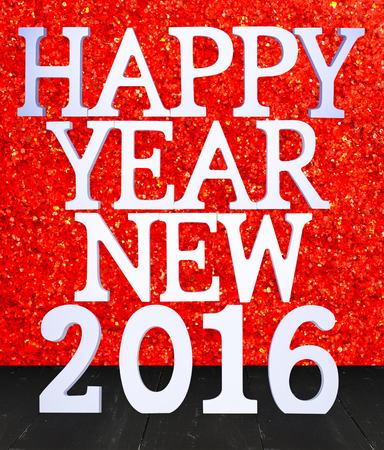 2016 year white wood number in perspective room with sparkling bokeh wall and black wooden plank...