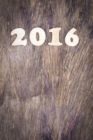 2016 year wood number on wooden plank with copyspace