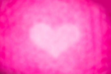 heart bokeh shape over pink backgroundの写真素材