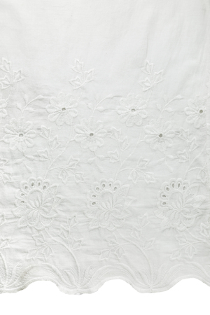 Detailed white fabric with floral patternの写真素材