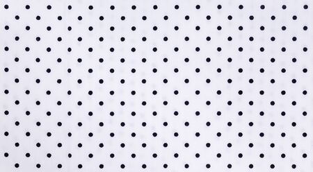 White Fabric and Black Tiny Polka Dots Background textureの写真素材