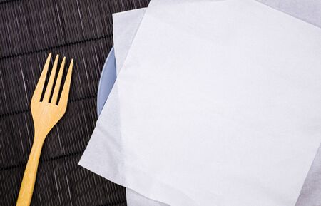 Empty dish with wooden fork, top viewの写真素材