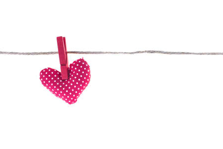 Handmade Love hearts hanging on rope over white background