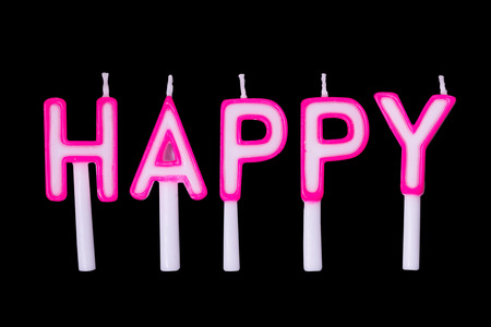 Happy birthday candles on black background,Alphabet candles in word "happy" on black backgroundの写真素材