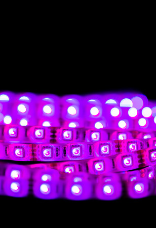 close up of Purple Led stripe light on black background , Selective focus