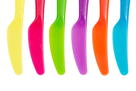 Bright plastic knives disposable tableware isolated on white