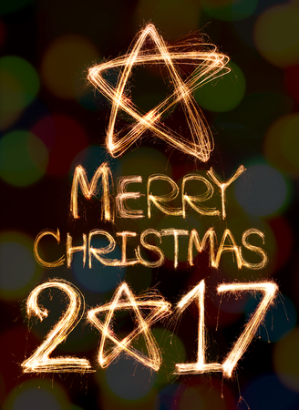 Merry Christmas 2017 written with Sparkling  light on bokeh backgroundの写真素材