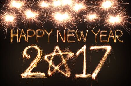 Happy new year 2017 written with Sparkle fireworkの写真素材