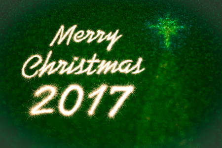 Merry christmas 2017 written with Sparkle firework over bokeh lightの写真素材
