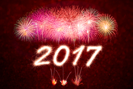 Happy new year 2017 written with Sparkle firecracker and firework