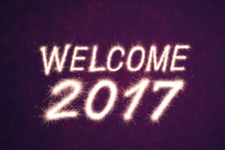 Welcome 2017 written from Sparkle firework with bokeh backgroundの写真素材