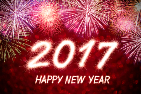 Happy new year 2017 written with Sparkle firecracker and fireworkの写真素材