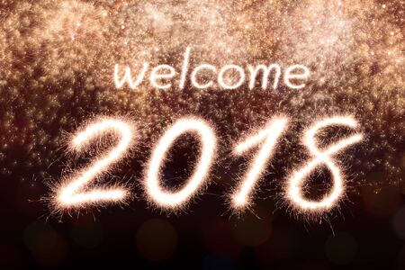 Welcome 2018 written from Sparkle firework with Sparkle firework backgroundの写真素材