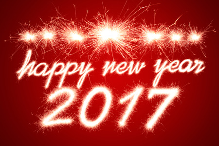 Happy new year 2017 written with Sparkle fireworkの写真素材
