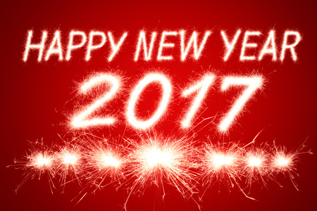 Happy new year 2017 written with Sparkle fireworkの写真素材