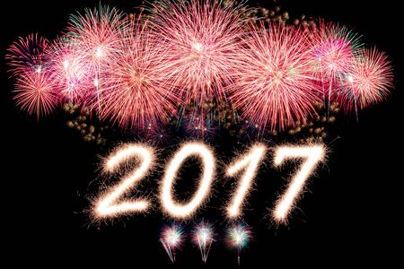Happy new year 2017 written with Sparkle firework with firework backgroundの写真素材