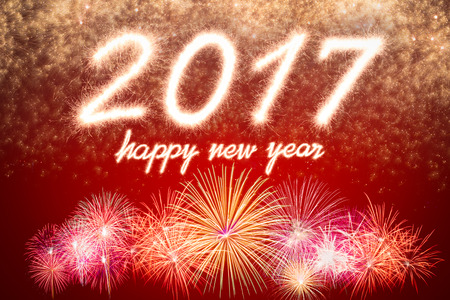 Happy new year 2017 written with Sparkle firecracker and fireworkの写真素材