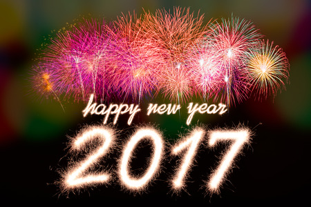 Happy new year 2017 written with Sparkle firecracker and fireworkの写真素材