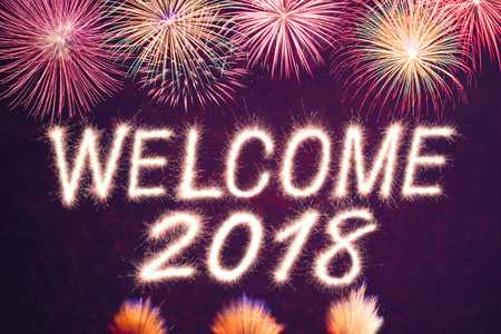 Welcome 2018 written from Sparkle firework with firework backgroundの写真素材