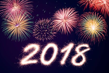 2018 written with Sparkle firecracker and fireworkの写真素材