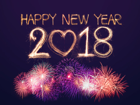 Happy new year 2018 written with Sparkle firecracker with  fireworkの写真素材
