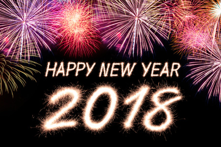 Happy new year 2018 written with Sparkle firecracker and fireworkの写真素材