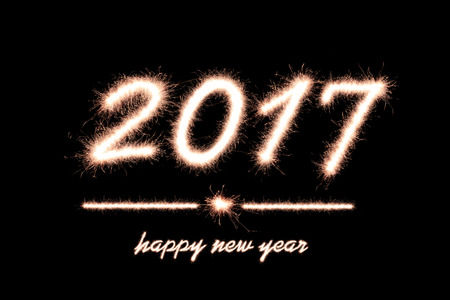 Happy new year 2017 written with Sparkle firework on black background
