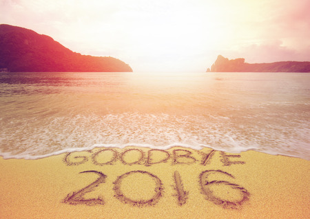 Goodbye 2016 written on beach at sunsetの写真素材