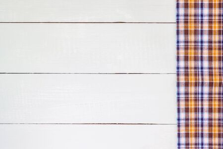 checkered tablecloth on wooden tableの写真素材