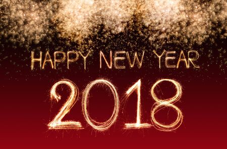Happy new year 2018 written with Sparkle firework and firework backgroundの写真素材