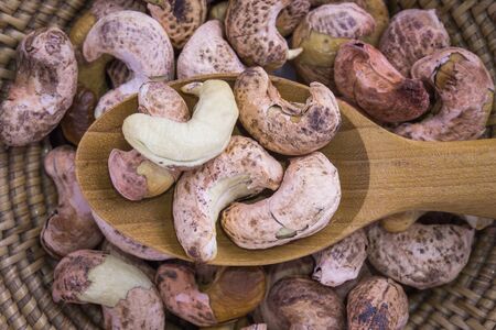 Close up of Cashews nut heap in wooden spoonの写真素材