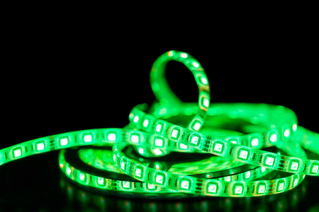 Green Led stripe light on black background, Selective focusの写真素材