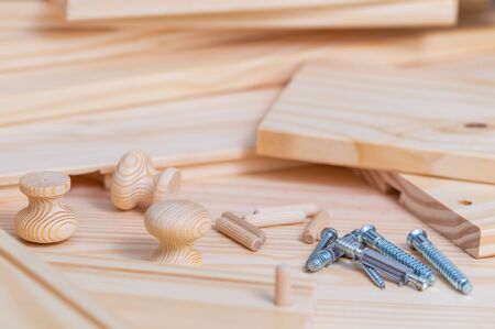 Close up of assembly furniture kit over Wood planks backgroundの写真素材