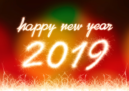 Happy new year 2019 written with Sparkle firework with firework backgroundの写真素材