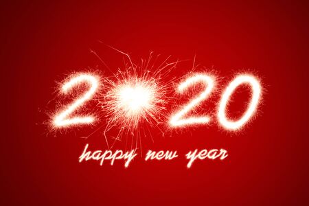 Happy new year, 2020 written with Sparkle fireworkの写真素材