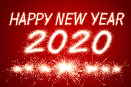Happy new year, 2020 written with Sparkle fireworkの写真素材
