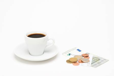 Cup of coffee with bill on white backgroundの写真素材