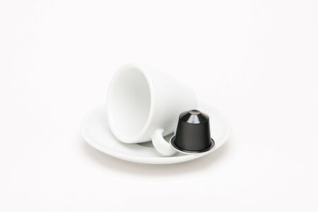 Cup of coffee with capsule on white backgroundのeditorial素材