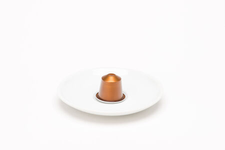 Cup of coffee with capsule on white backgroundのeditorial素材