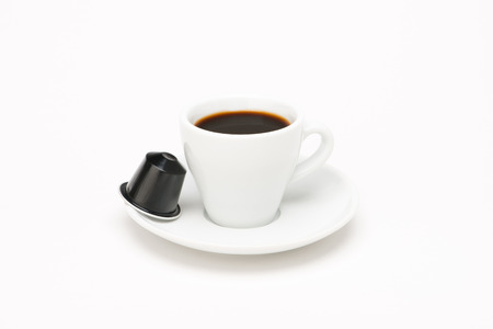 Cup of coffee with capsule on white backgroundのeditorial素材