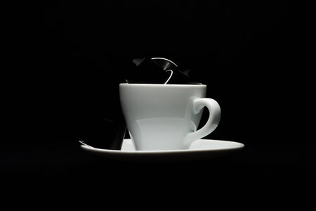 Cup of coffee with capsules on black backgroundのeditorial素材