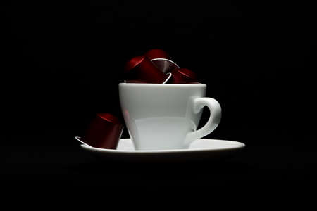 Cup of coffee with capsules on black backgroundのeditorial素材