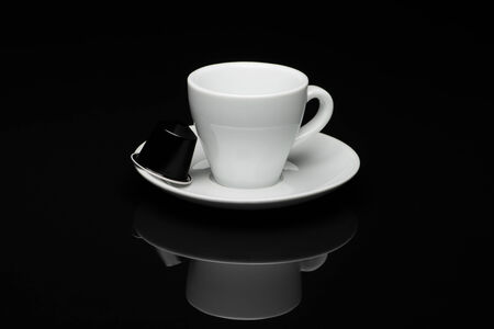 Cup of coffee on black background with reflectionのeditorial素材