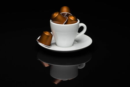 Cup of coffee with capsules on black background with reflectionのeditorial素材