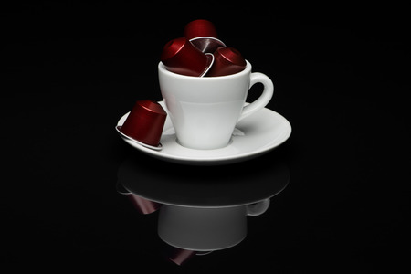 Cup of coffee with capsules on black background with reflectionのeditorial素材